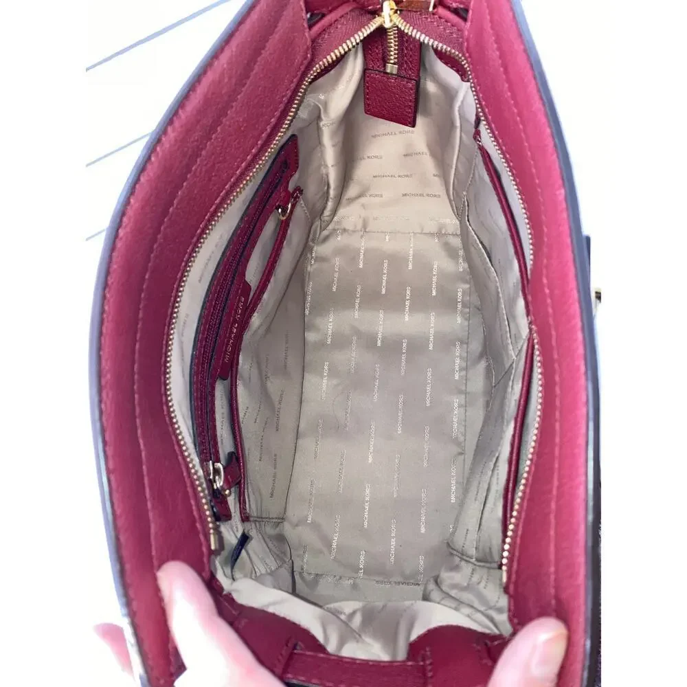 MICHAEL KORS, LARGE WINE LEATHER HANDBAG WITH LOCK CHARM.